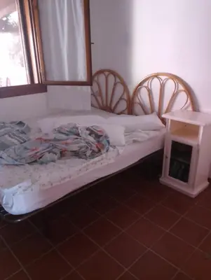 Letto o letti in una camera di Residence Costa Caddu San Teodoro