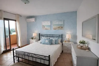 Letto o letti in una camera di Il Mirto apartment con piscina