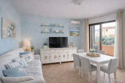 TV o dispositivi per l'intrattenimento presso Il Mirto apartment con piscina