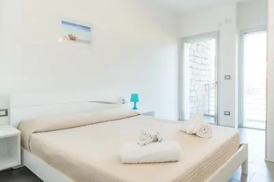 Letto o letti in una camera di Residence L'Ancora