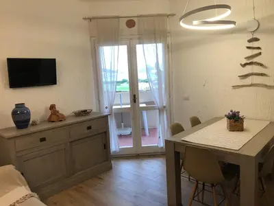 TV o dispositivi per l'intrattenimento presso Cozy retreat just 150 meters from the beach