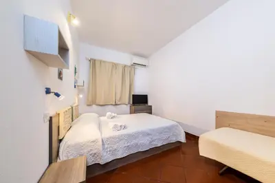 Letto o letti in una camera di Olbia Villa Doriana 2BR 5PX FreePark Jacuzzi