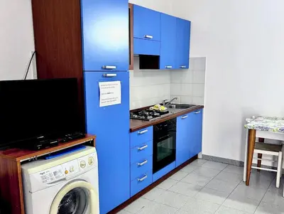Cucina o angolo cottura di ISS Travel, Apartment 4 beds with garden in San Teodoro just 700 mt from la Cinta Beach