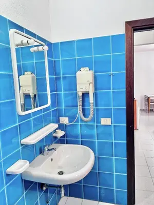 Bagno di ISS Travel, Apartment 4 beds with garden in San Teodoro just 700 mt from la Cinta Beach