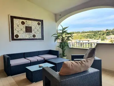 Area soggiorno di Casabel - Appartamento con veranda panoramica a Orosei