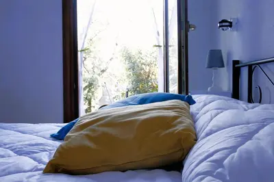 Letto o letti in una camera di Casa Quercia - Affitti Brevi Italia