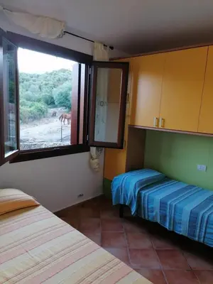 Letto o letti in una camera di Lu Sulianu