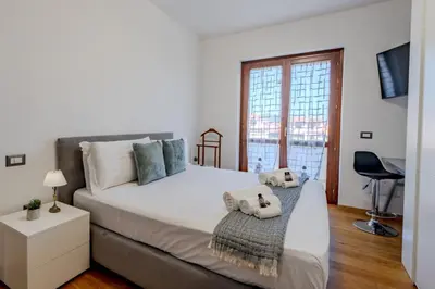 Letto o letti in una camera di OlbiAmare Appartamento di Lusso