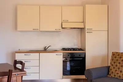 Cucina o angolo cottura di Residenze del Porto - Budoni Sweet Home