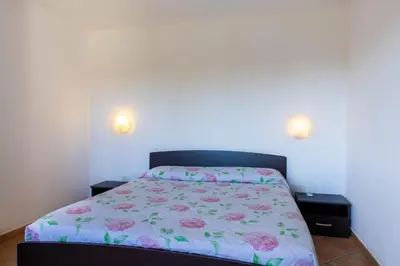Letto o letti in una camera di Residenze del Porto - Budoni Sweet Home