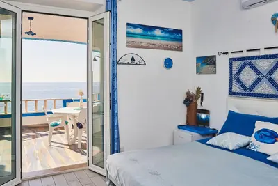 Letto o letti in una camera di B&B AcquaDolce