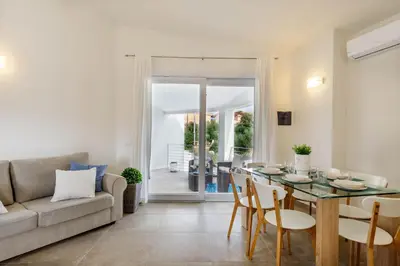 Area soggiorno di Caneis Apartments