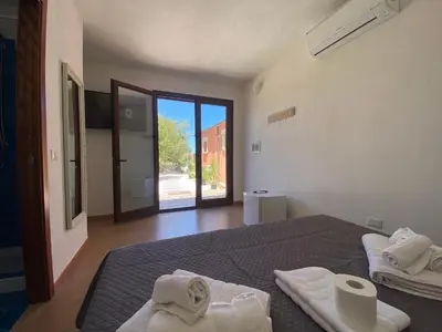 Letto o letti in una camera di QUADRIFOGLIO Affittacamere