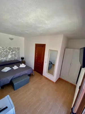 Letto o letti in una camera di QUADRIFOGLIO Affittacamere