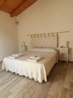 Letto o letti in una camera di Nacchinono