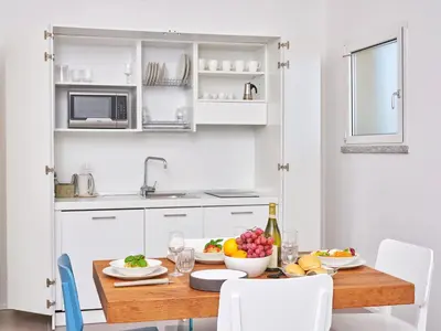 Cucina o angolo cottura di Felix Hotels - Hotel Residence Porto San Paolo