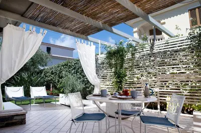 Area soggiorno di Orosei Home Holidays - Rimediu