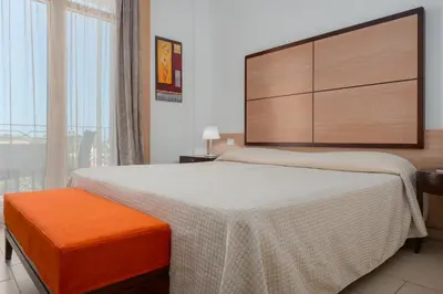 Letto o letti in una camera di The Pelican Beach Resort & SPA - Adults Only