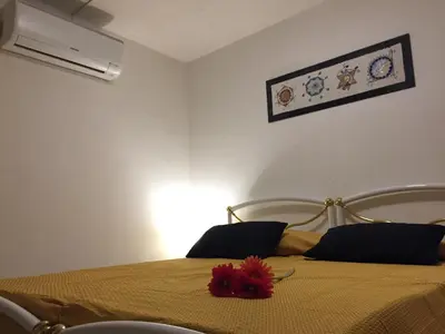 Letto o letti in una camera di Casa Arborea