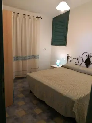 Letto o letti in una camera di Casa vacanza Tanaunella