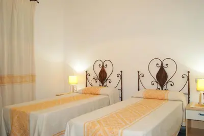 Letto o letti in una camera di Casa vacanza Tanaunella