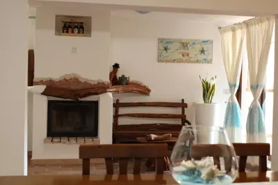 Area soggiorno di Casa vacanza Tanaunella