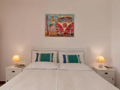 Letto o letti in una camera di Villa Rosa