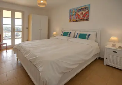Letto o letti in una camera di Villa Rosa