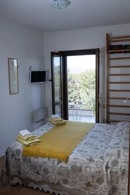 Letto o letti in una camera di Camera vista mare, ingresso indipendente in