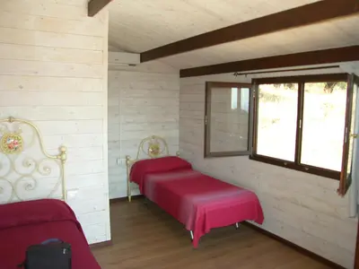 Letto o letti in una camera di Agriturismo Su Nuragheddu