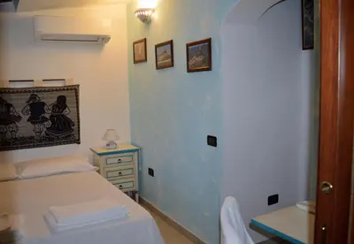 Letto o letti in una camera di B&B Feronia