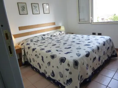 Letto o letti in una camera di Casa Gemma