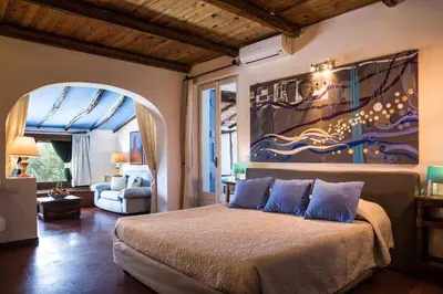 Letto o letti in una camera di PALMASERA CHARMING - Rooms & Suites