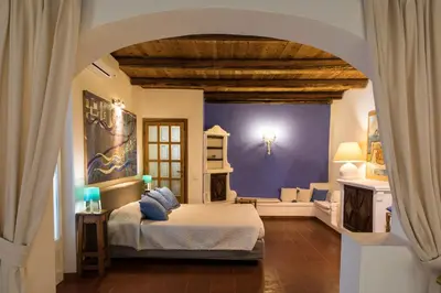 Letto o letti in una camera di PALMASERA CHARMING - Rooms & Suites
