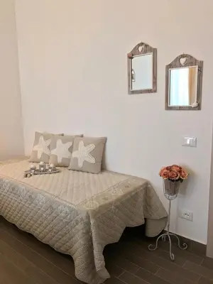 Letto o letti in una camera di PALMASERA CHARMING - Rooms & Suites