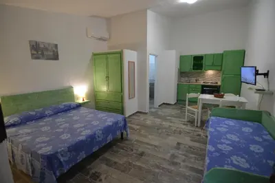 Letto o letti in una camera di Residence L'Ulivo