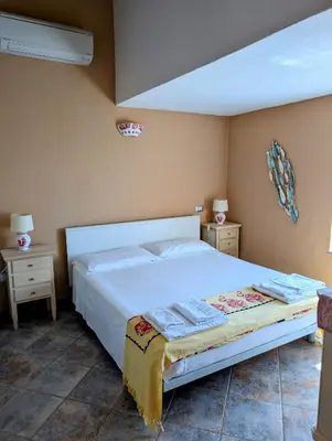 Letto o letti in una camera di Capo Ceraso Family Resort