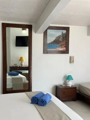 Letto o letti in una camera di Hotel Villa Cedrino
