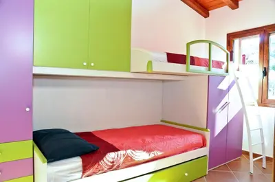 Letto o letti in una camera di ISS Travel, Stazzu Fioritu - ground floor apartments with sea view