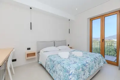 Letto o letti in una camera di Antares Rooms and Suites