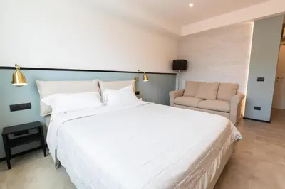 Letto o letti in una camera di Antares Rooms and Suites