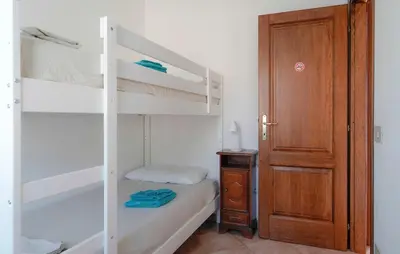 Letto o letti in una camera di Sardegna - Villa Mirto & Flowers