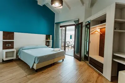 Letto o letti in una camera di I Ginepri Hotel