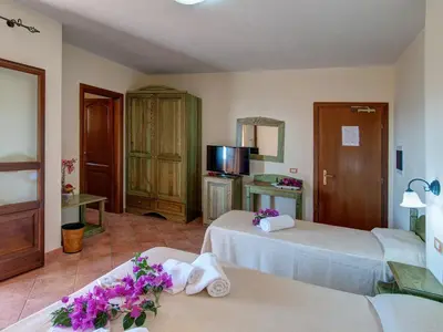 Letto o letti in una camera di I Ginepri Hotel