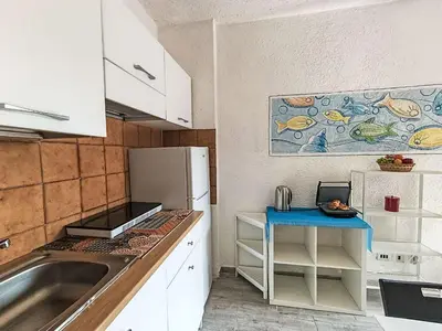 Cucina o angolo cottura di Apartment Iris 7- Terza Spiaggia by Interhome