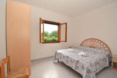 Letto o letti in una camera di Appartamento Coclearia
