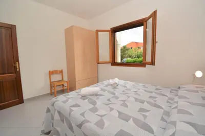 Letto o letti in una camera di Appartamento Coclearia
