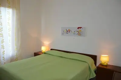 Letto o letti in una camera di Sa domo manna