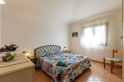 Letto o letti in una camera di Villetta San Teodoro