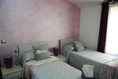 Letto o letti in una camera di B&B Kenzia